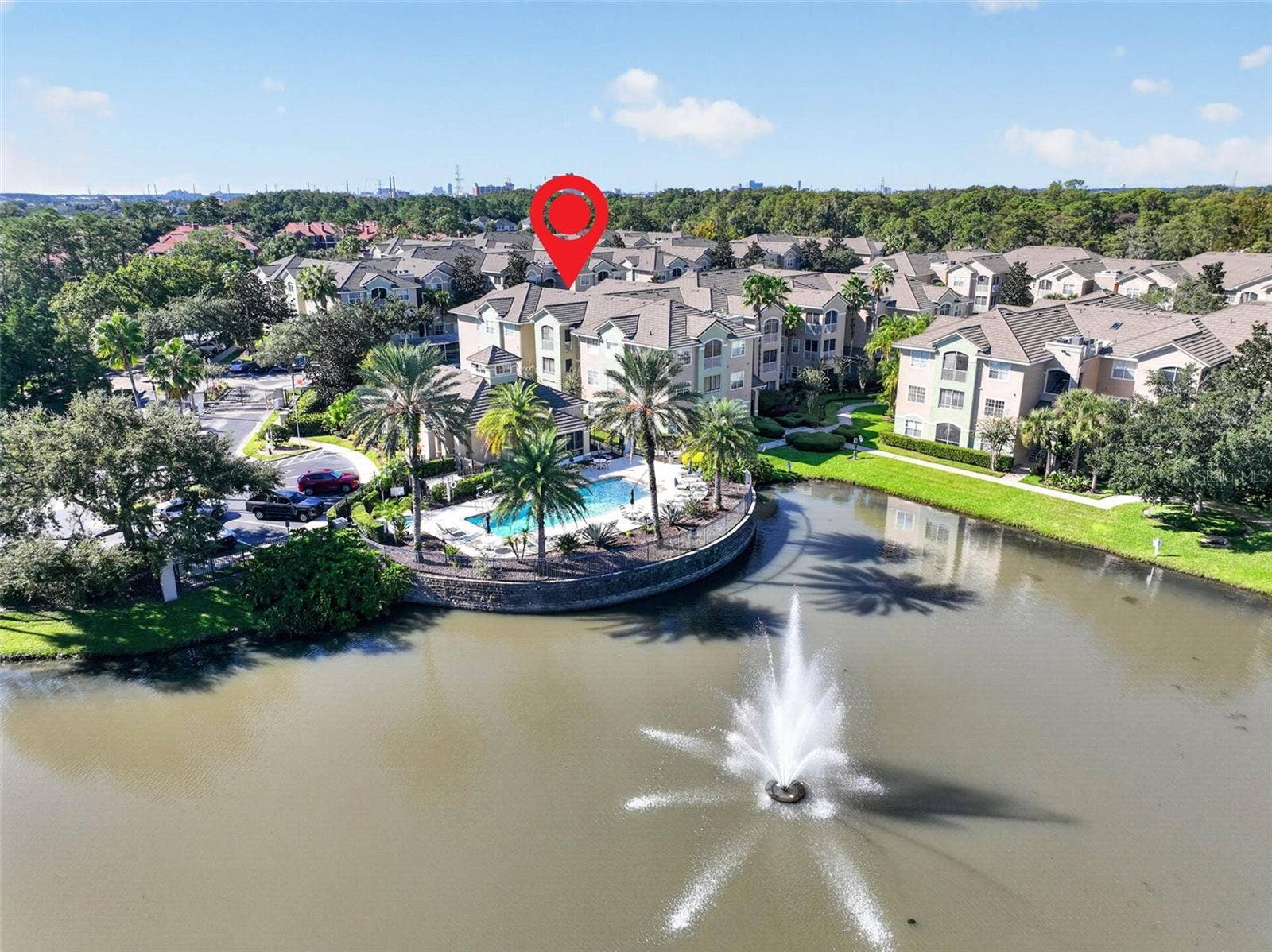 Aerial of pool and fountain with location pin on building