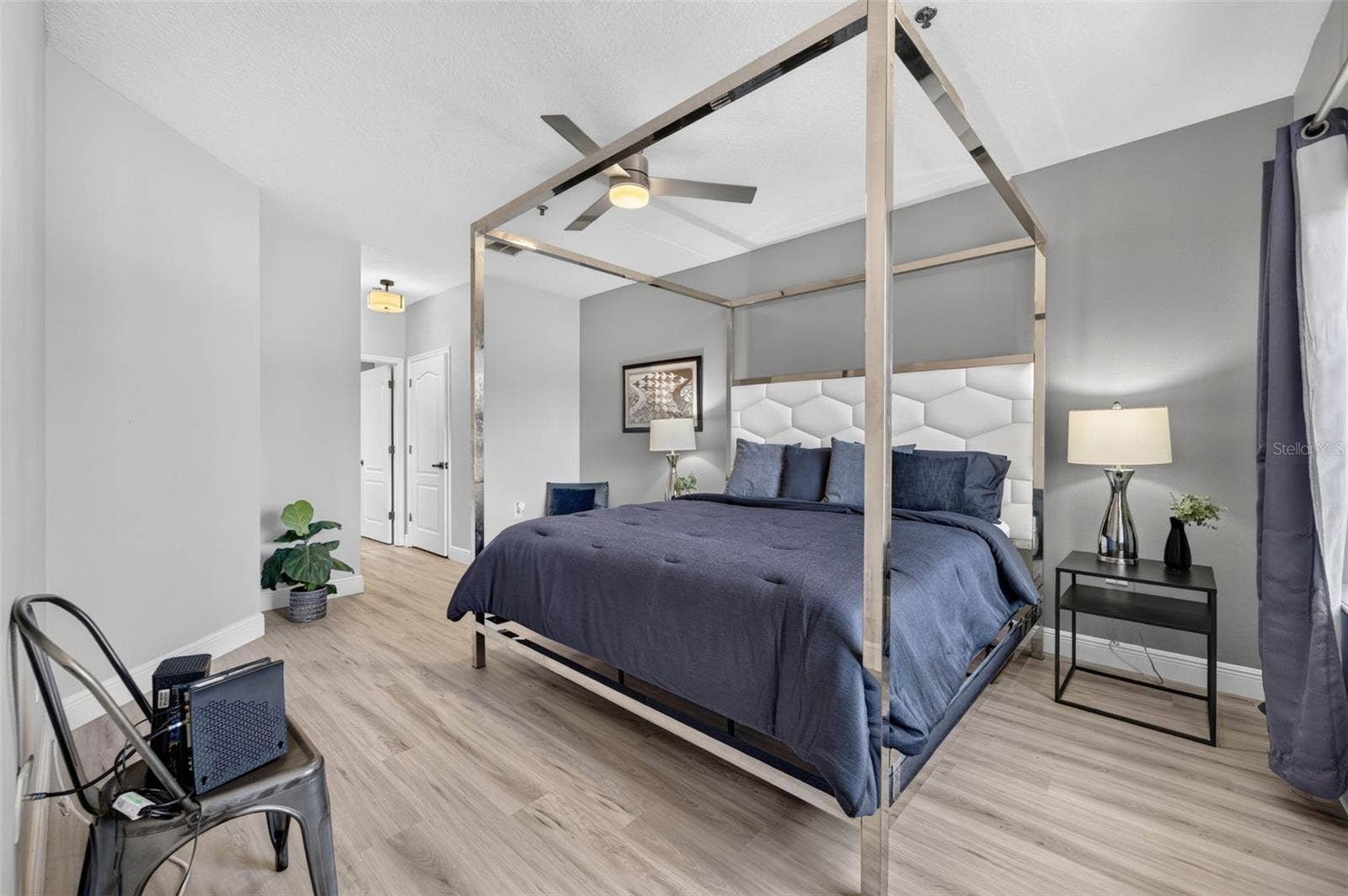 Primary bedroom with canopy bed