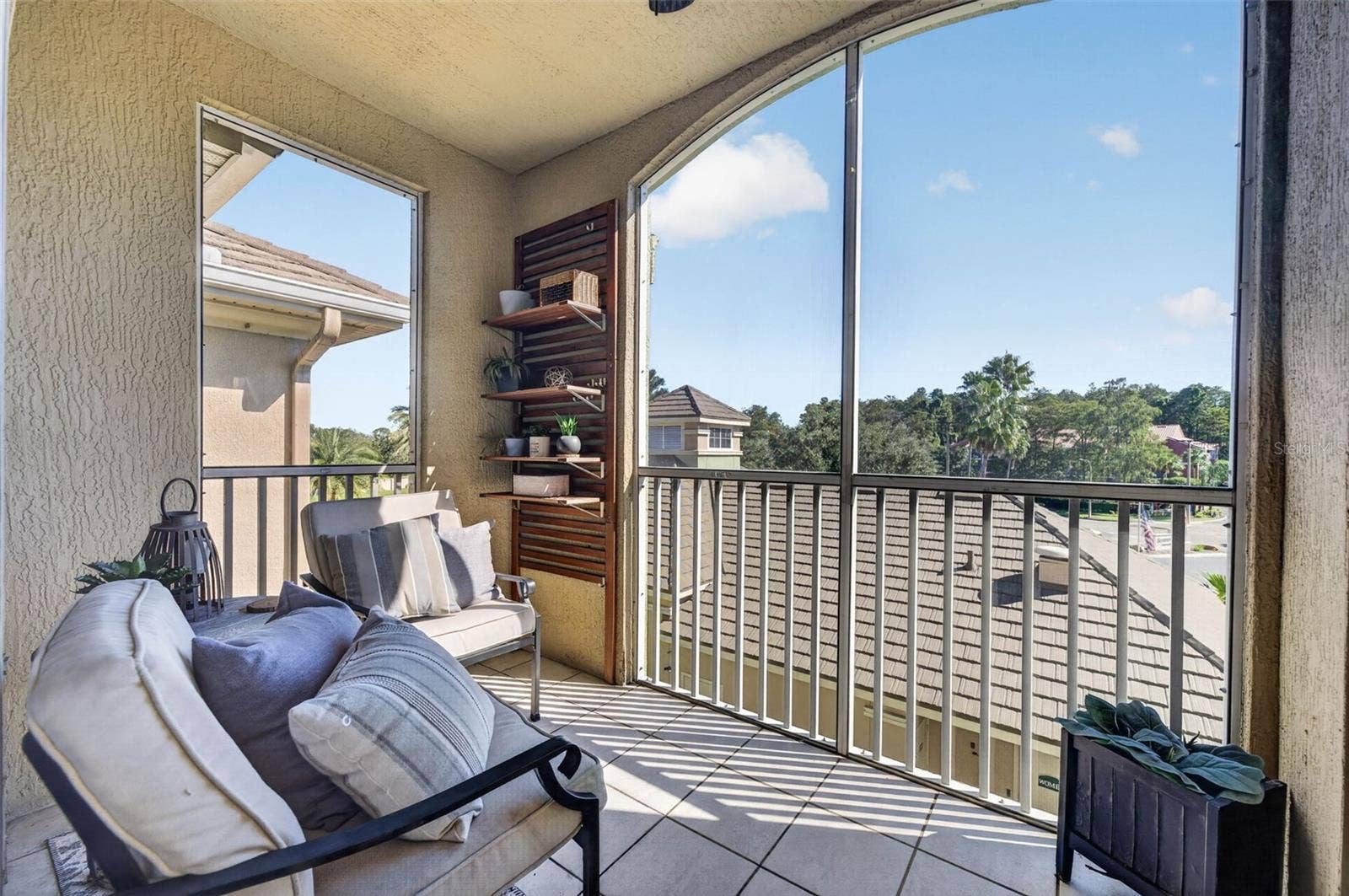 Screened balcony with storage closet and view