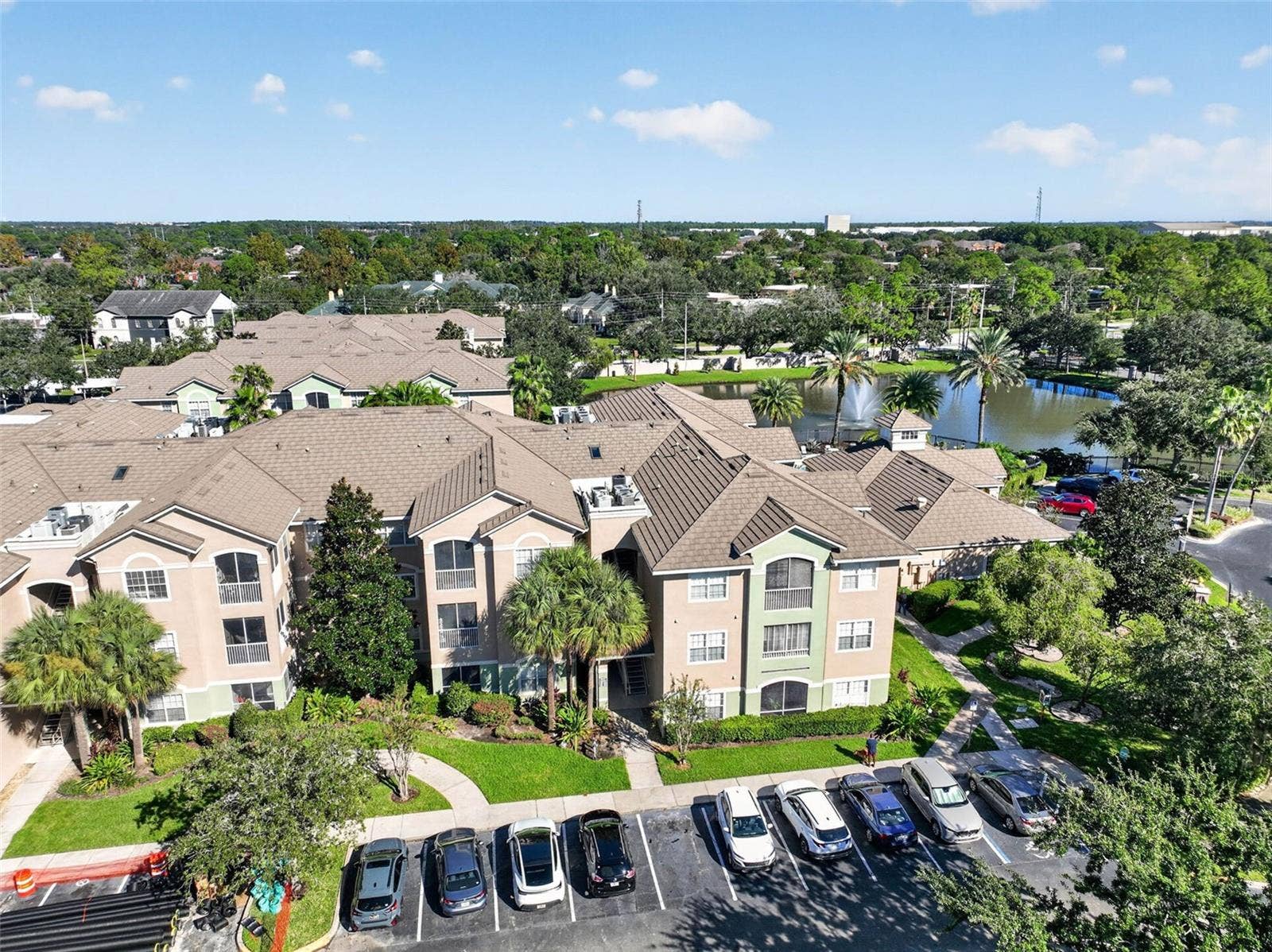 Aerial view of building front and parking