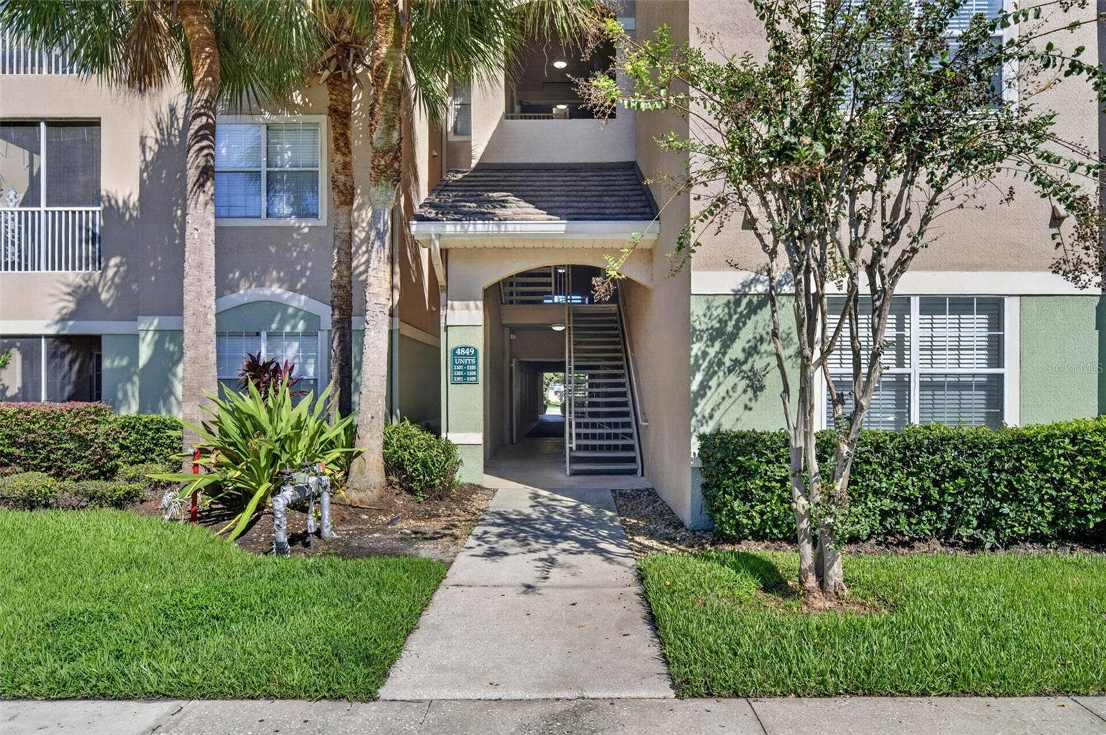 Building entrance and stairwell to third-floor unit