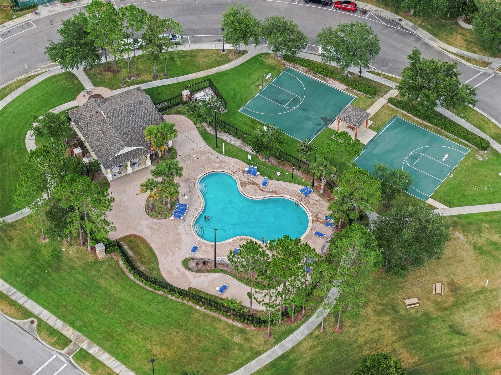 Community pool and recreation area with guest parking