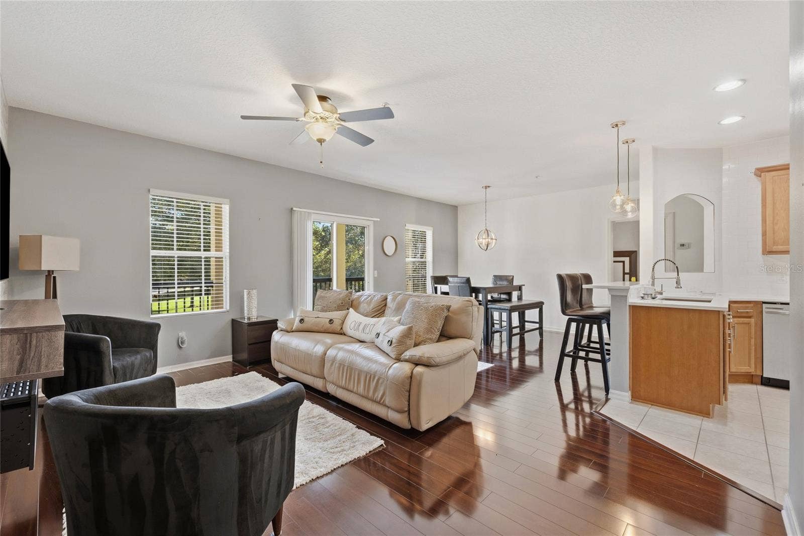 Open concept family dining area combo with Kitchen featuring laminate floors, ceiling fan
