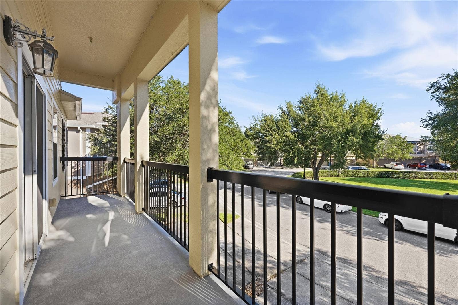 Beautiful balcony with views of cul-d-sac and grassy area