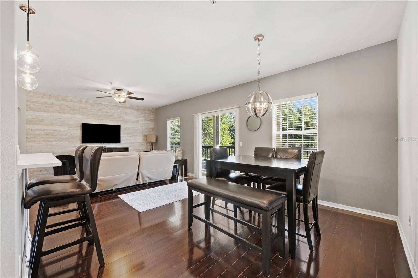 dining area/family room combo area with sliding glass door that leads to balcony
