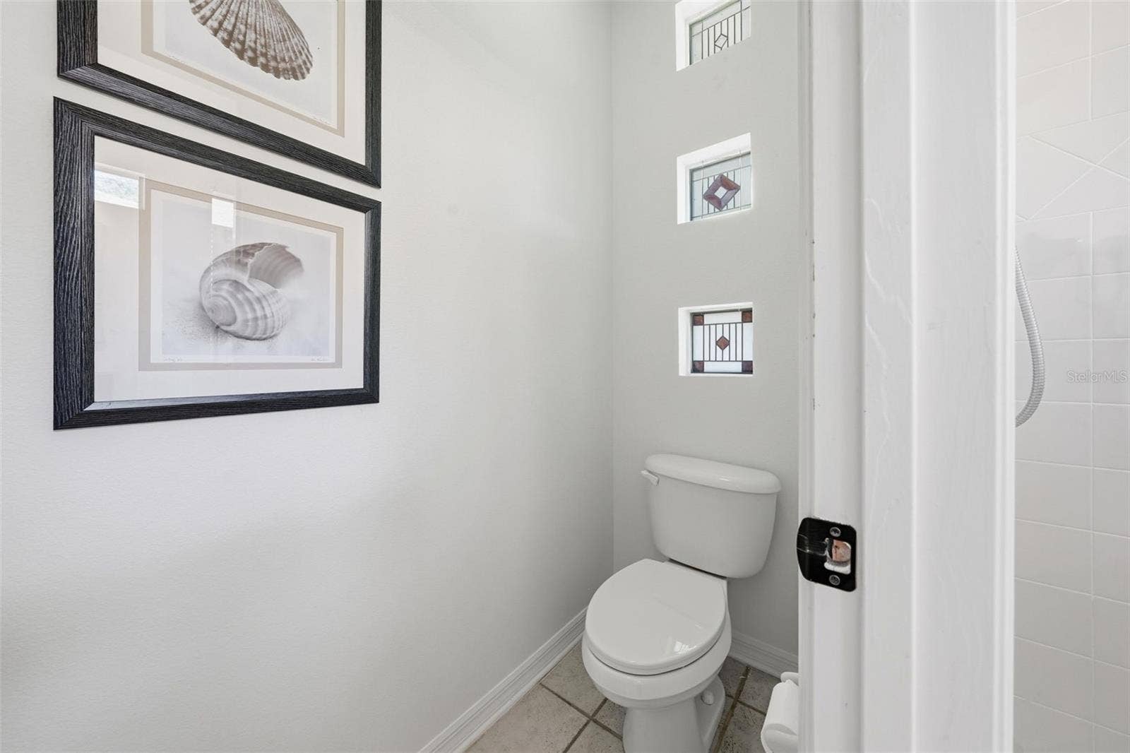 WATER CLOSET IN THE PRIMARY BATHROOM