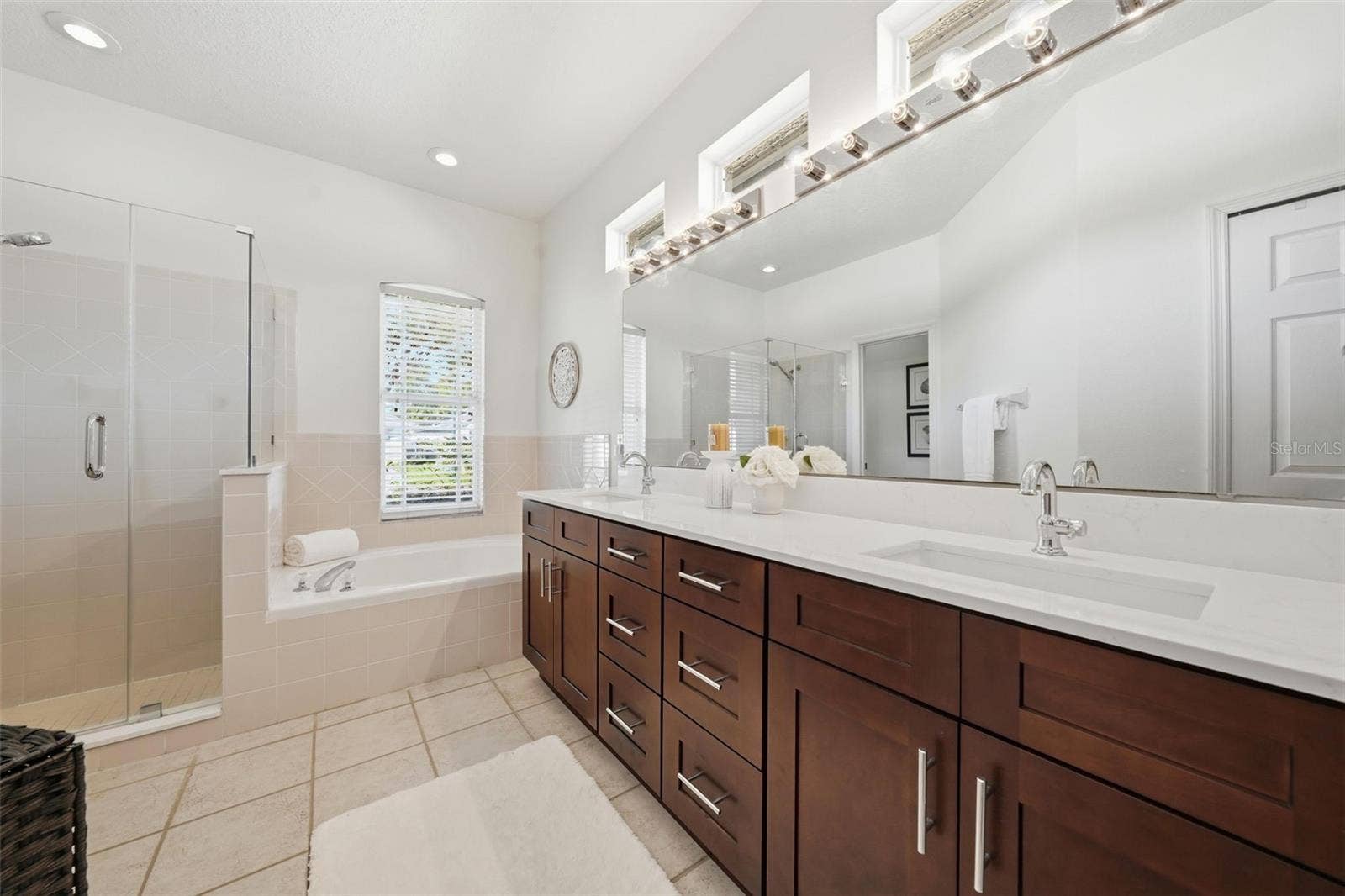 PRIMARY BATHROOM WITH NEW SEAMLESS GLASS ENCLOSURE, TUB AND DOUBLE SINK VANITY