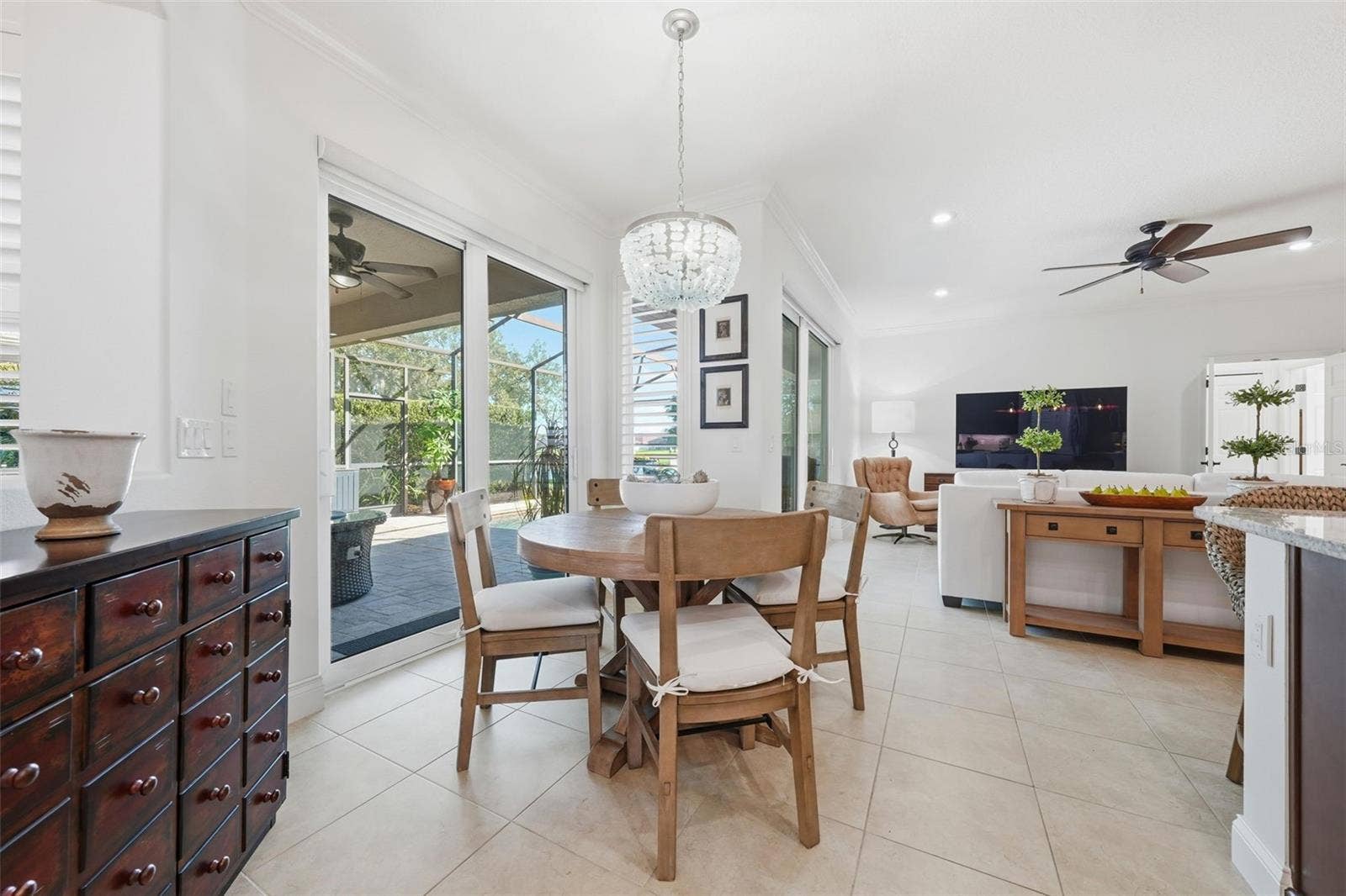 DINETTE WITH LOVELY LIGHT FIXTURE, NEW SLIDING DOORS WITH MOTORIZED BLINDS