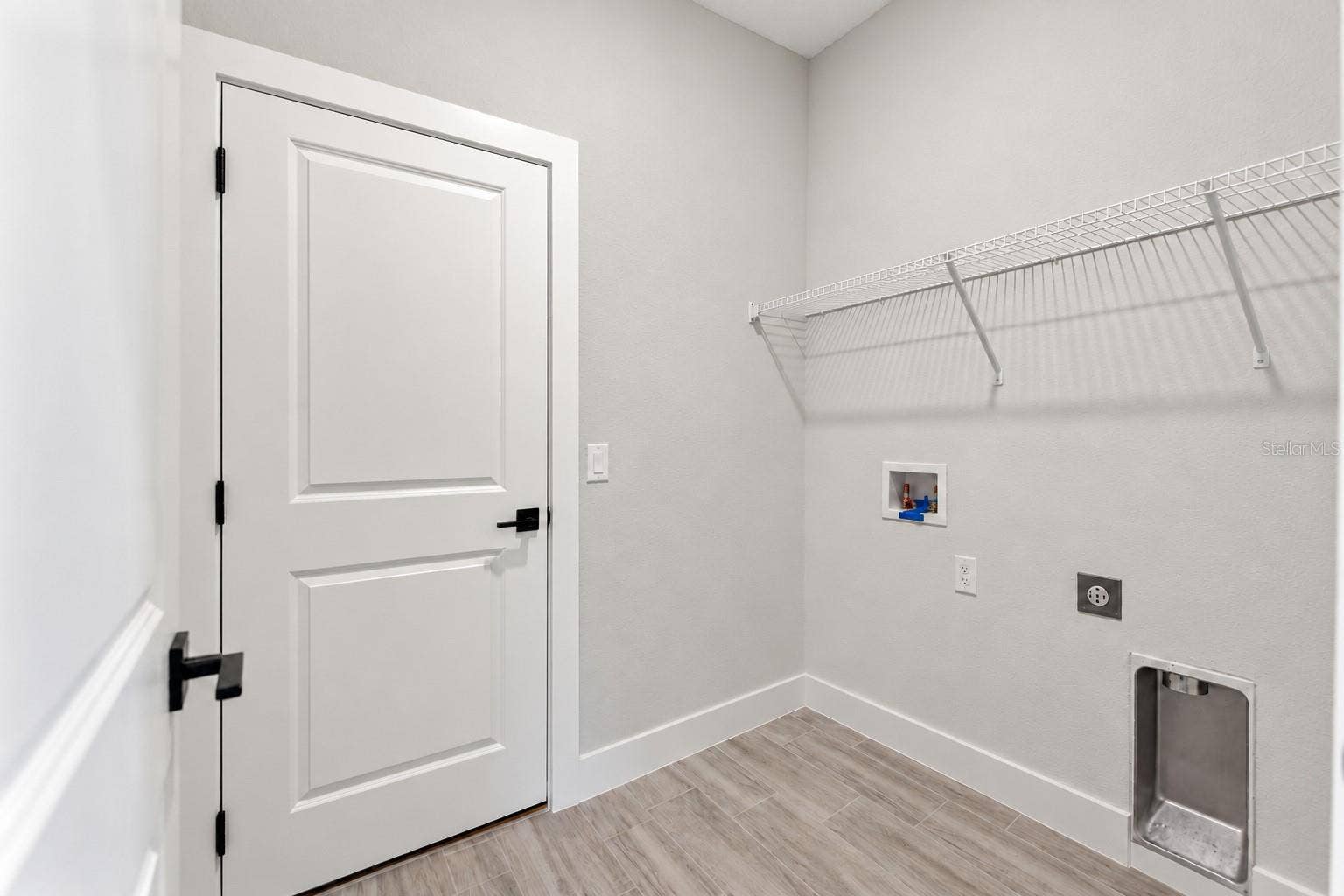 24479 SW KINGSWAY CIRCLE, Arcadia, FL 34269 Laundry room. Digitally edited model/property composite.
