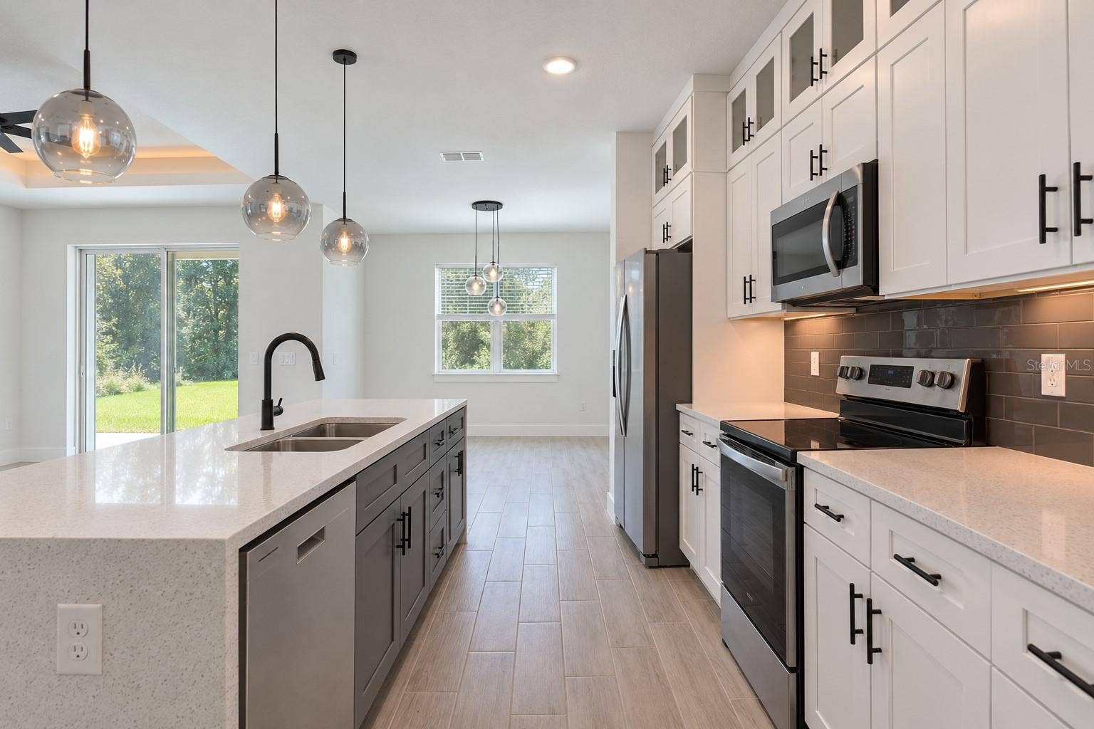 24479 SW KINGSWAY CIRCLE, Arcadia, FL 34269 Kitchen reverse view. Digitally edited model/property composite.