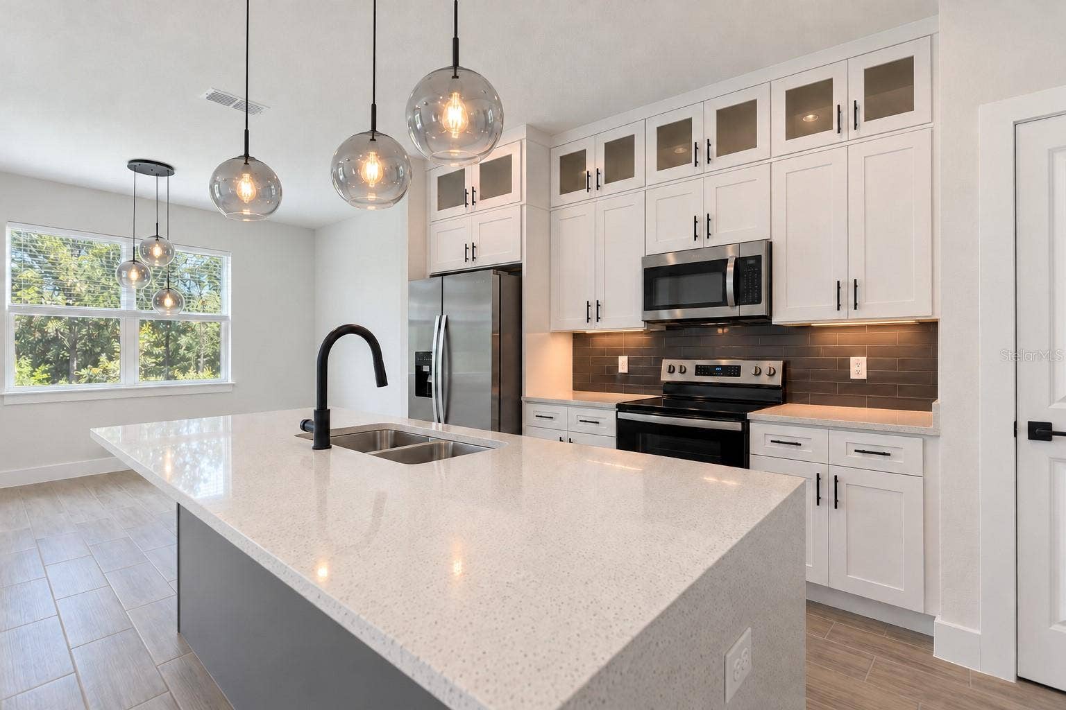 24479 SW KINGSWAY CIRCLE, Arcadia, FL 34269 Kitchen sink angle. Digitally edited model/property composite.
