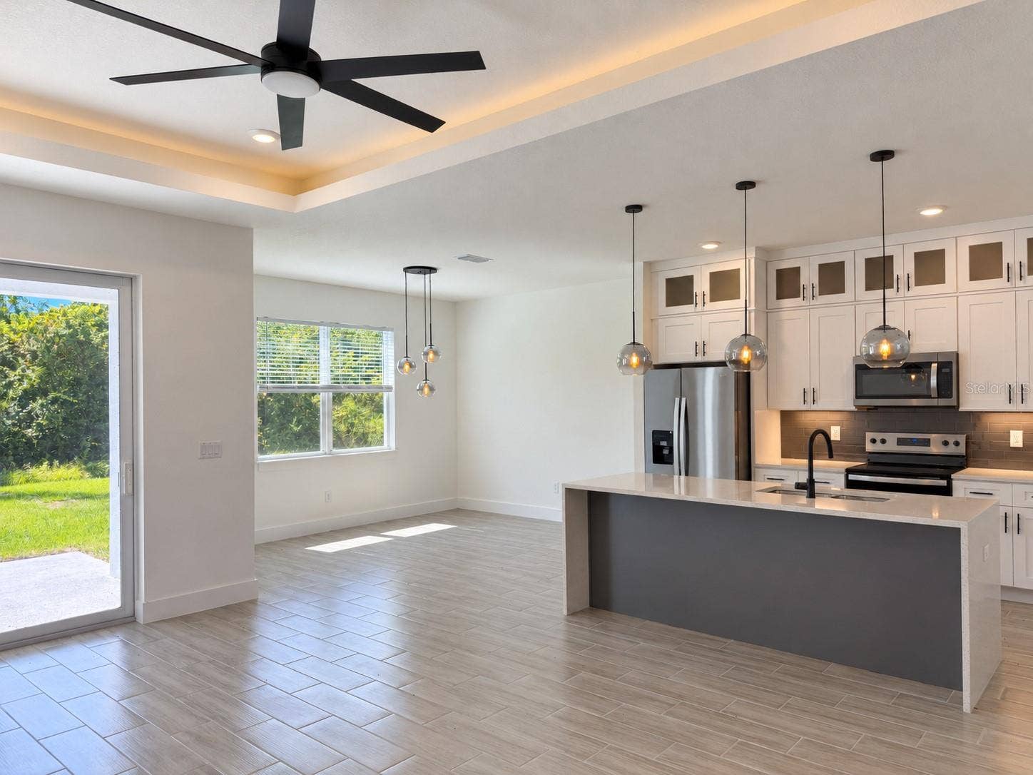 24479 SW KINGSWAY CIRCLE, Arcadia, FL 34269 Kitchen and dining connection. Actual property photo, digitally refined.