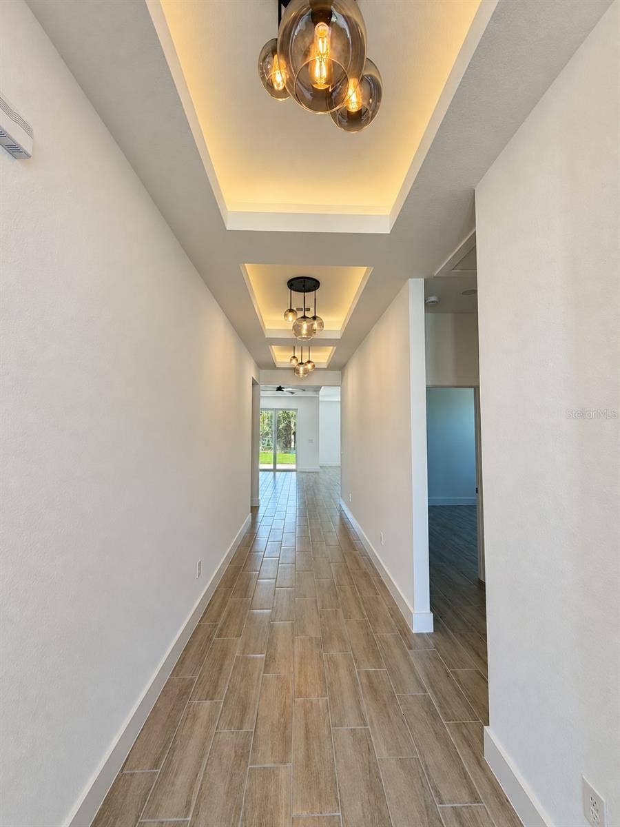 24479 SW KINGSWAY CIRCLE, Arcadia, FL 34269 Entry lighting detail. Actual property photo, digitally refined.