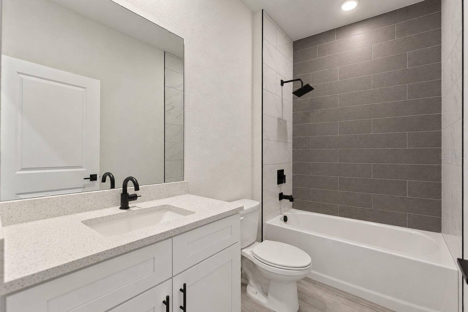 24479 SW KINGSWAY CIRCLE, Arcadia, FL 34269 Guest bathroom. Digitally edited model/property composite.
