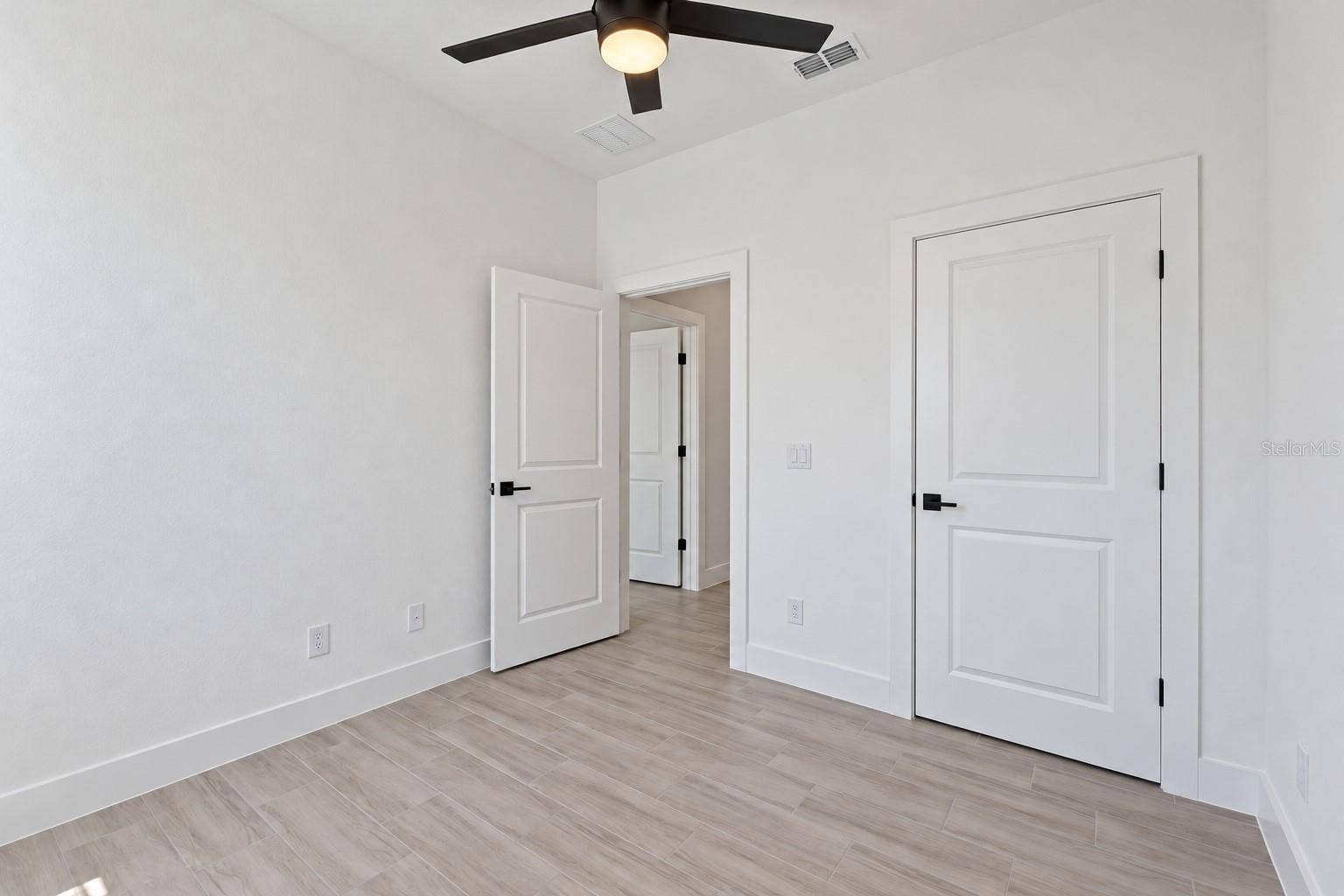24479 SW KINGSWAY CIRCLE, Arcadia, FL 34269 Bedroom three reverse view. Digitally edited model/property composite.