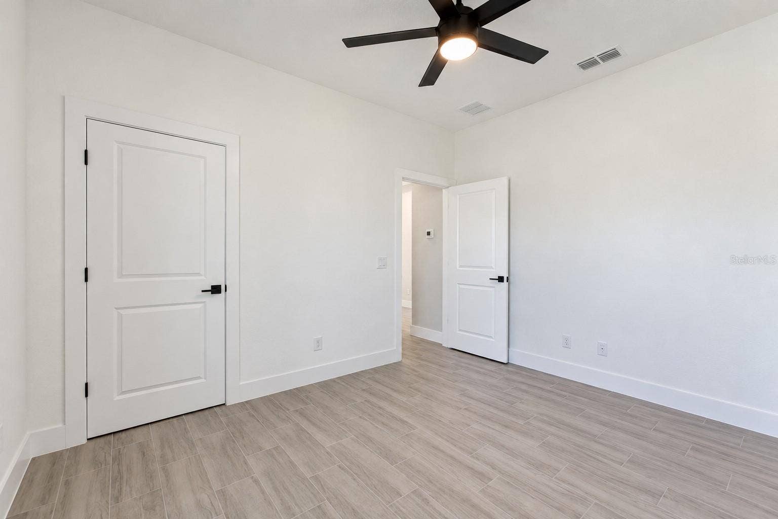 24479 SW KINGSWAY CIRCLE, Arcadia, FL 34269 Bedroom two reverse view. Digitally edited model/property composite.