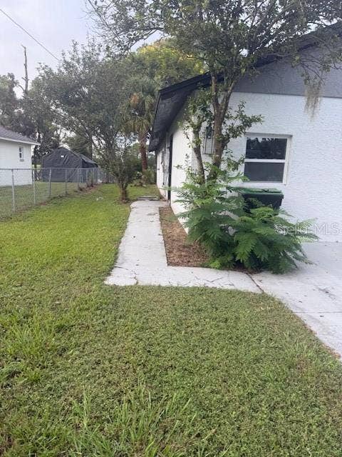 225 RONNIE CIRCLE, Orlando, FL 32811 Left side of the home.