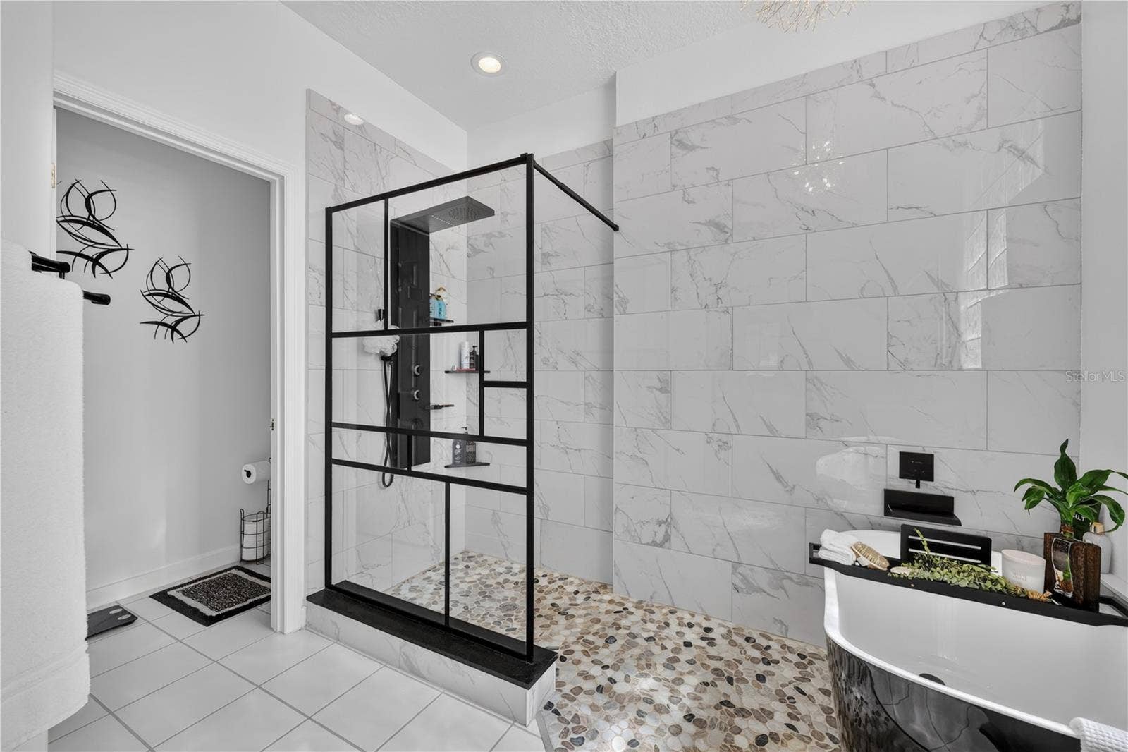 1854 VISTA ROYALE BOULEVARD, Orlando, FL 32835 This shower enclosure is as beautiful as it is functional.