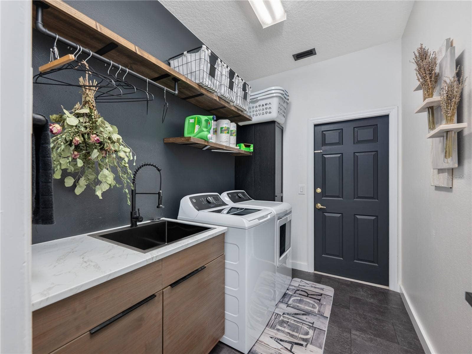 1854 VISTA ROYALE BOULEVARD, Orlando, FL 32835 Beautiful laundry room featuring built-in shelving and a functional utility sink.