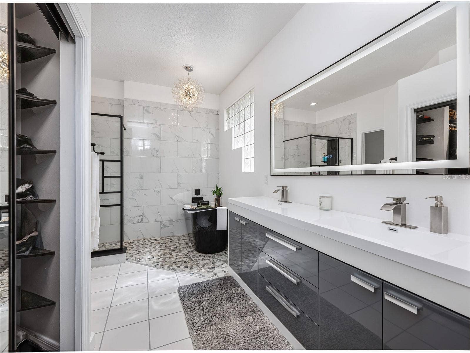 1854 VISTA ROYALE BOULEVARD, Orlando, FL 32835 Spa-like primary bathroom featuring modern finishes and a relaxing atmosphere.