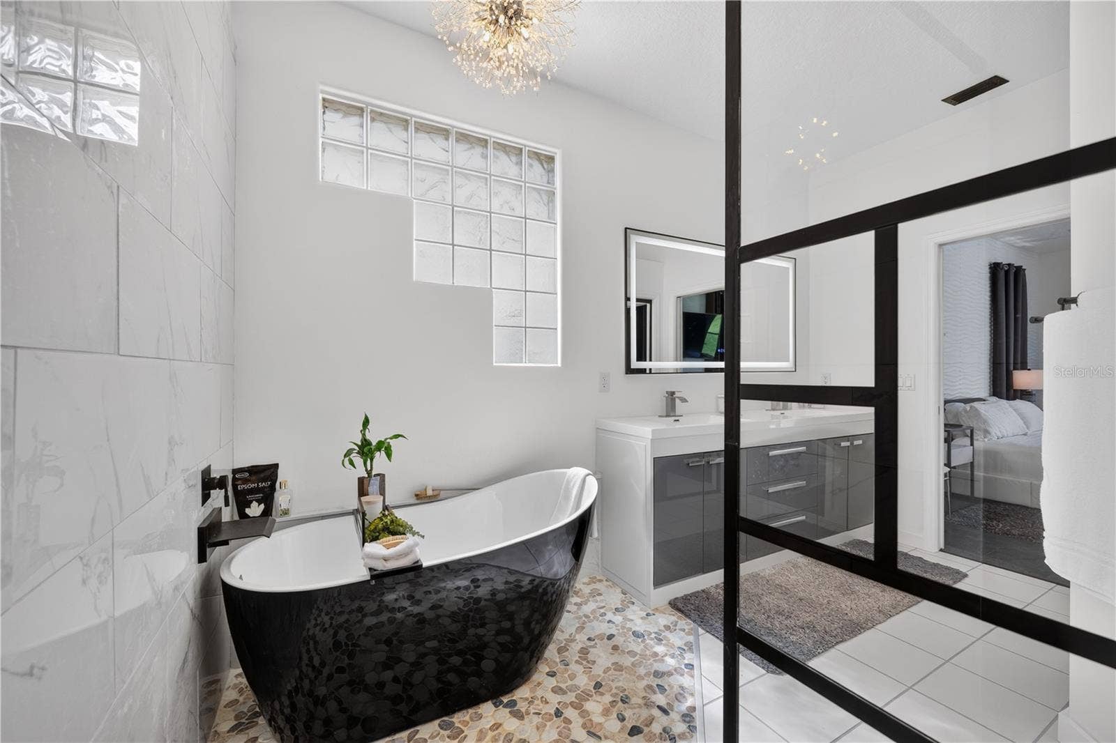 1854 VISTA ROYALE BOULEVARD, Orlando, FL 32835 The star of the primary bathroom is a luxurious soaking tub.