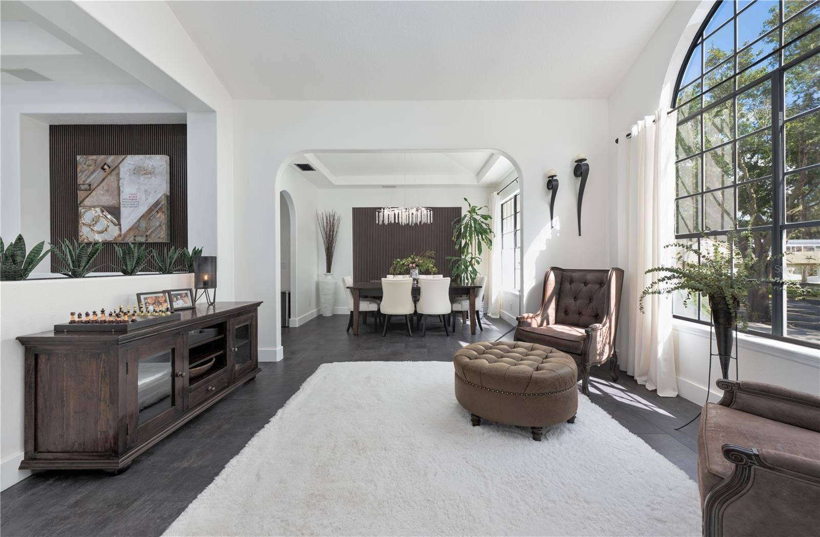 1854 VISTA ROYALE BOULEVARD, Orlando, FL 32835 Natural light fills the formal living room and dining room.