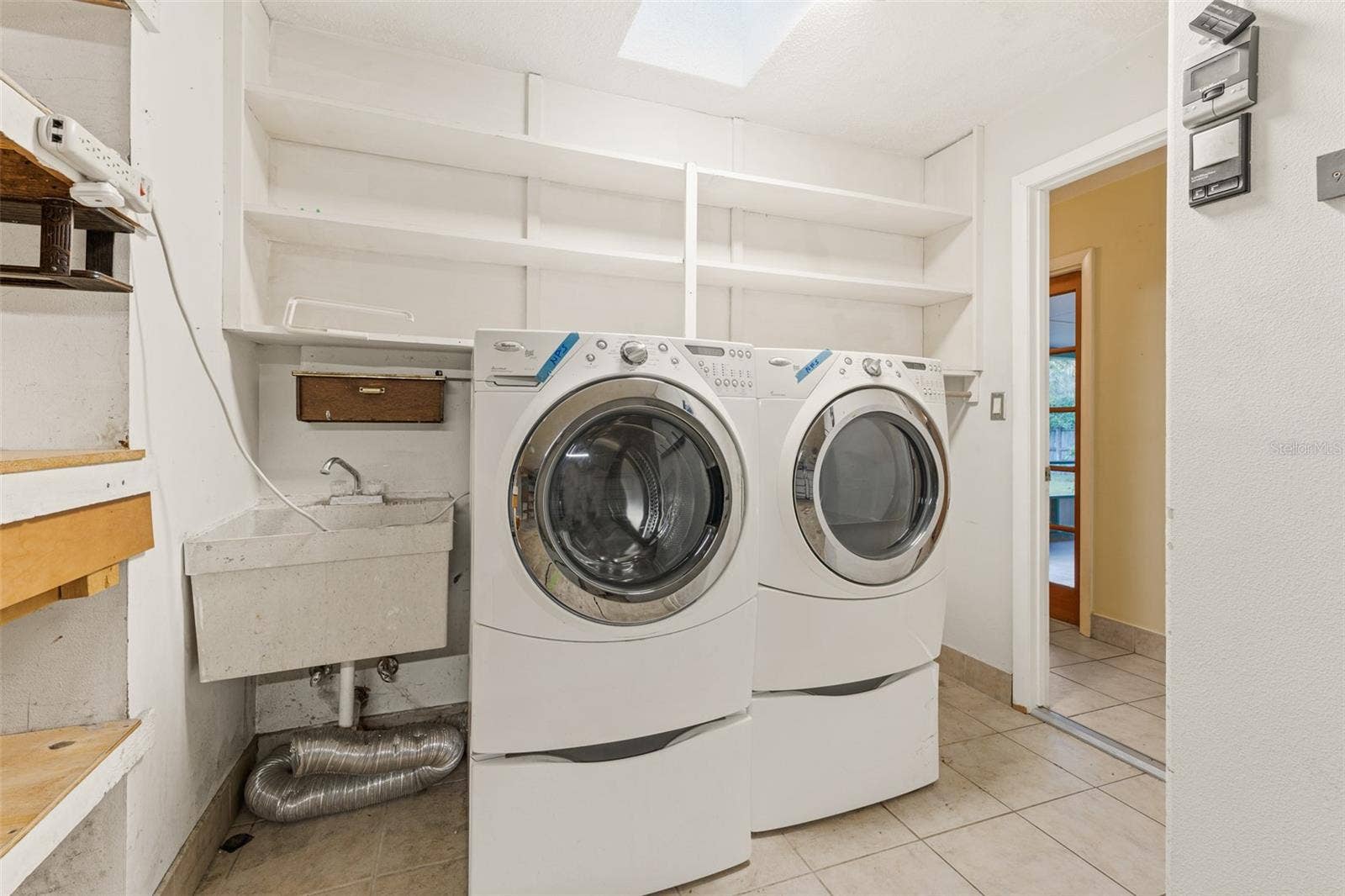 638 ORANGE COURT, Rockledge, FL 32955 Laundry with Built-In Shelving, Sink