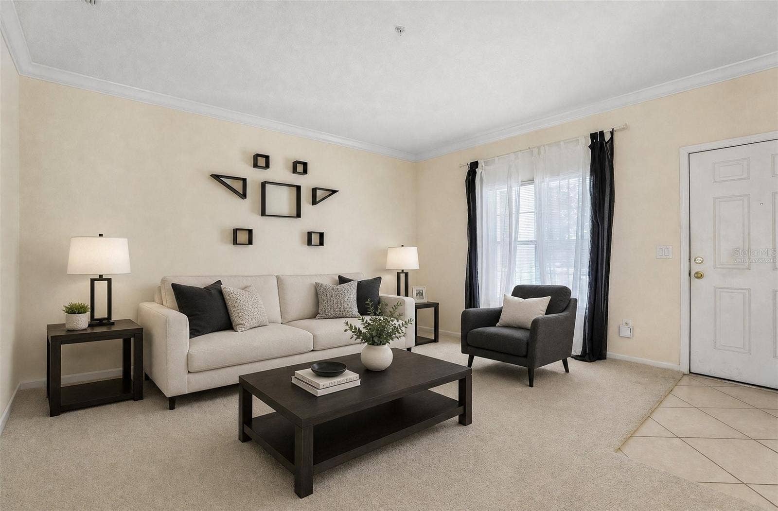 Formal living at the front of the home. Virtually Staged.
