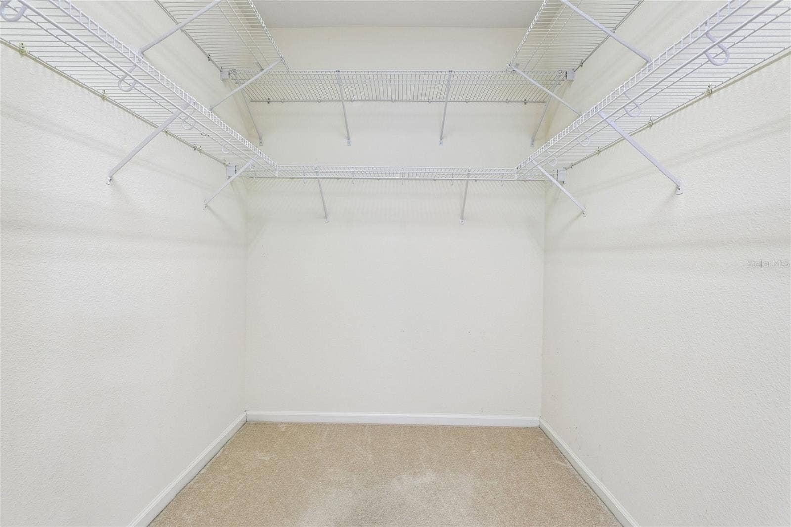 Primary suite walk-in closet.