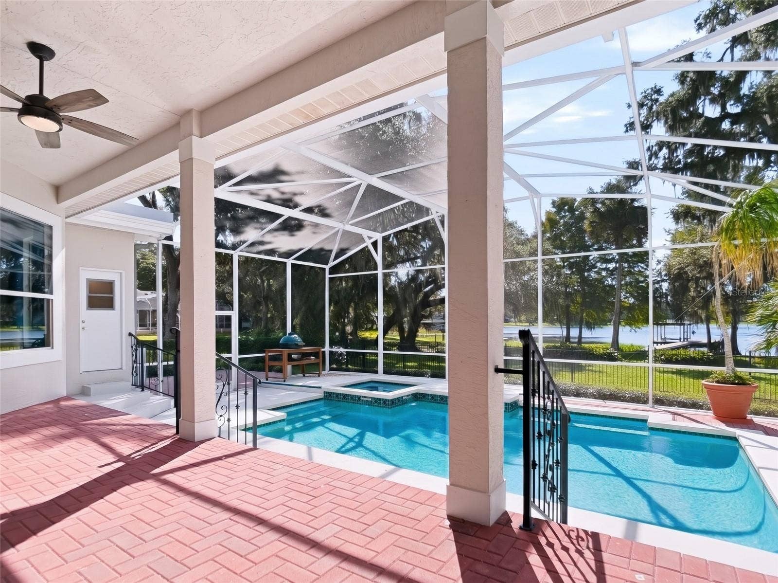 1128 OAKPOINT CIRCLE, Apopka, FL 32712 Elevated brick porch with pool and lake views