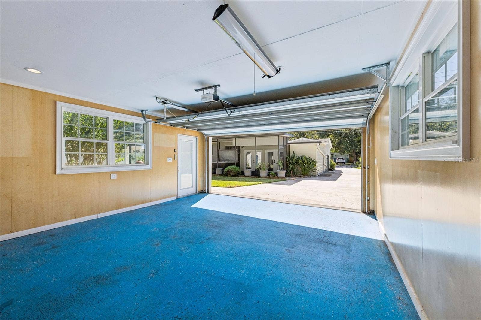 3115 HARGILL DRIVE, Orlando, FL 32806 This view shows the long extended driveway that could hold 8 cars ! views of the screen porch and hot tub