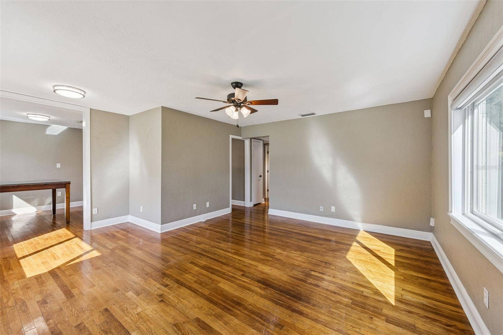 3115 HARGILL DRIVE, Orlando, FL 32806 Family room with a dining room view