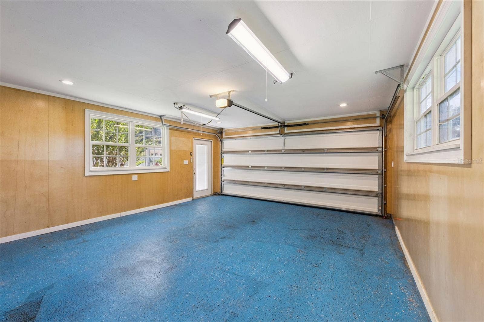 3115 HARGILL DRIVE, Orlando, FL 32806 Front of the tandem 4 car garage is open for your vehicles.