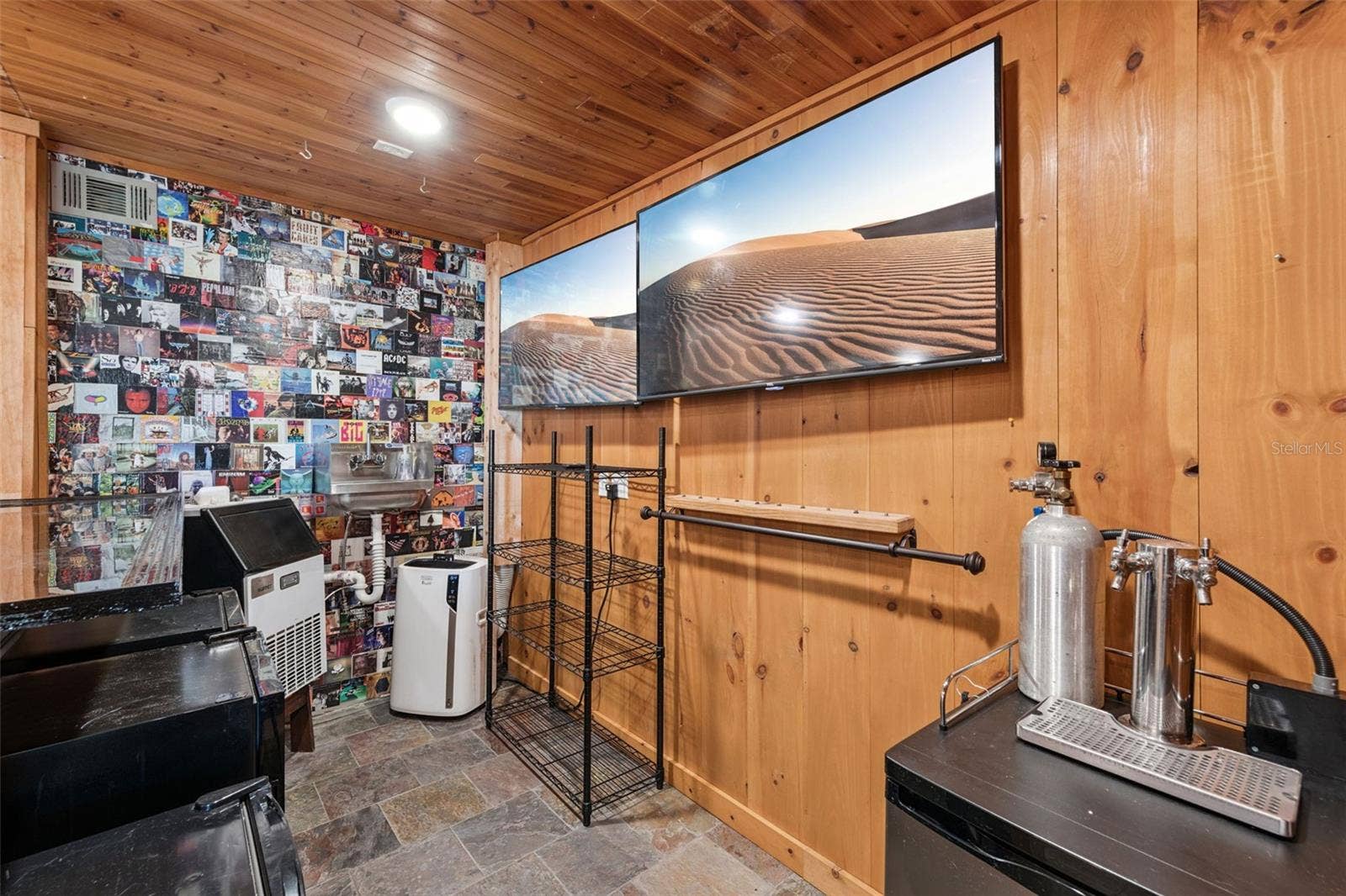 3115 HARGILL DRIVE, Orlando, FL 32806 Another view of the bar set up with Ice Machine, Air conditioner, Sink, Kegerator, Wine Fridge and 2 additional fridges for your cans and glassware. This space is ready to entertain !
