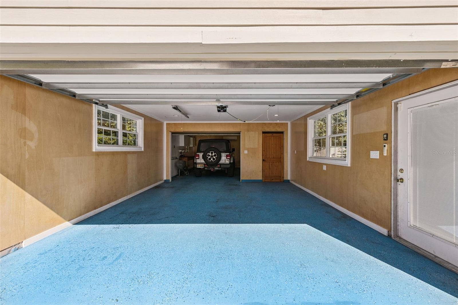 3115 HARGILL DRIVE, Orlando, FL 32806 Another look at the Tandem garage with the backside currently holding a 4 door jeep and electric bikes, perfect for heading downtown on the bike trails; or over to the Hourglass Brewery and Claddagh Cottage just around the corner.