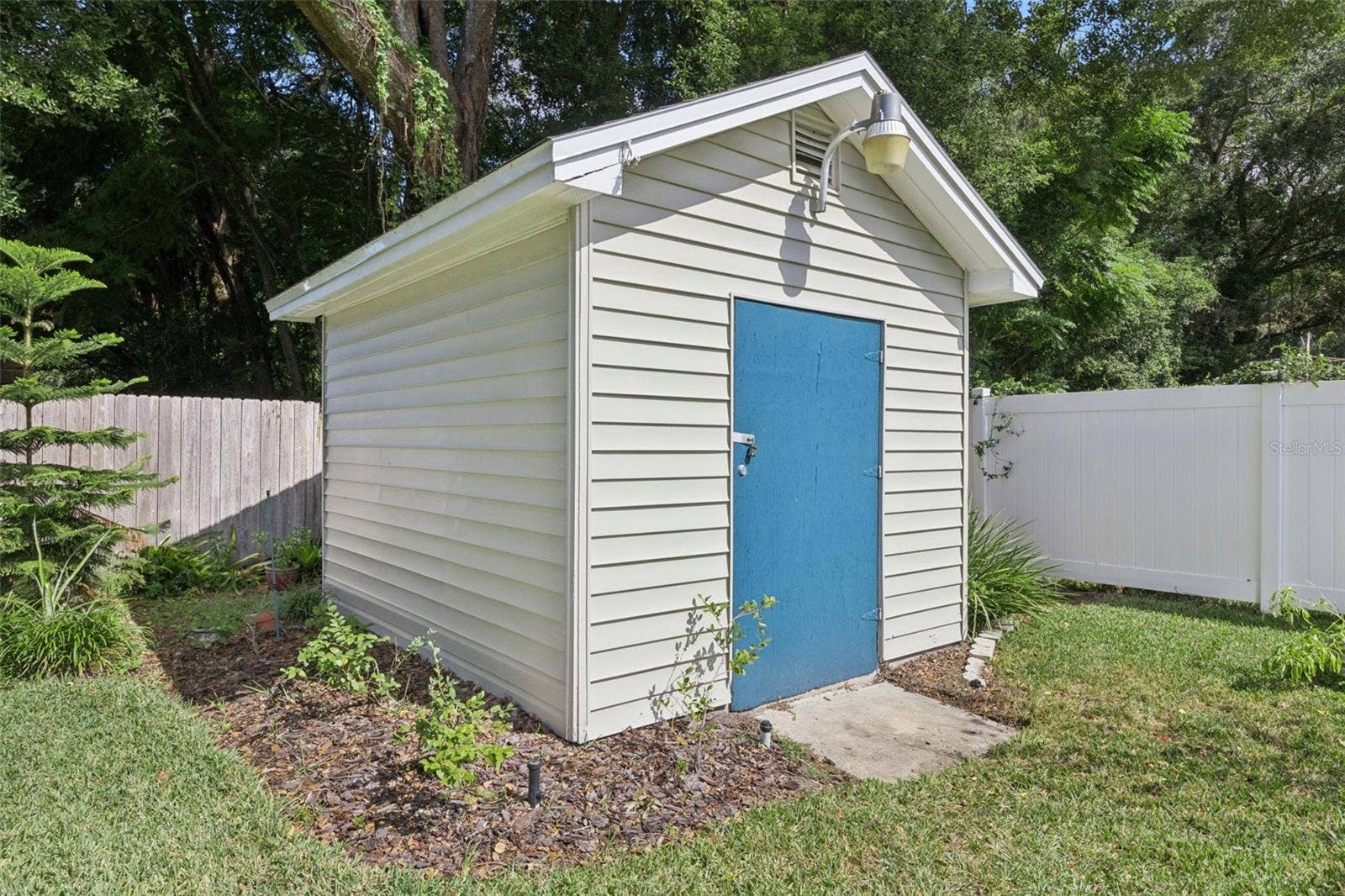 3115 HARGILL DRIVE, Orlando, FL 32806 Workshop / Shed. with an irrigation well and 4 zone sprinkler set up behind.