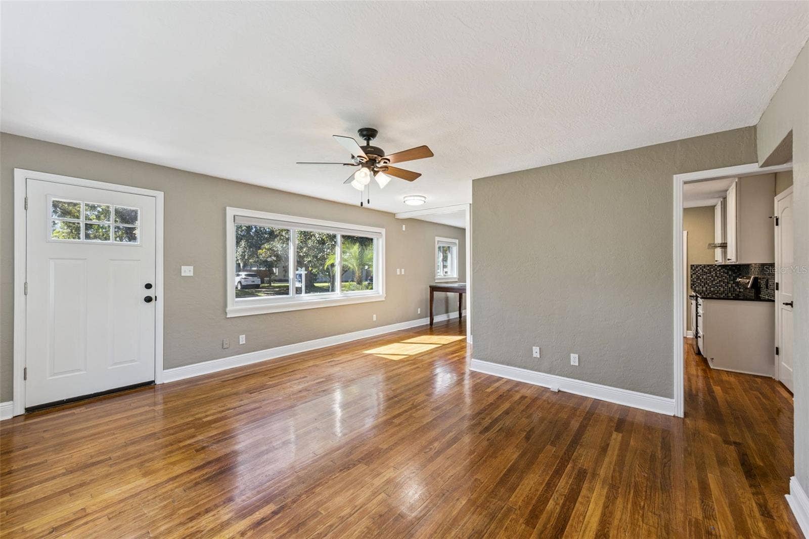 3115 HARGILL DRIVE, Orlando, FL 32806 Original hardwood floors and new windows make for a great family room