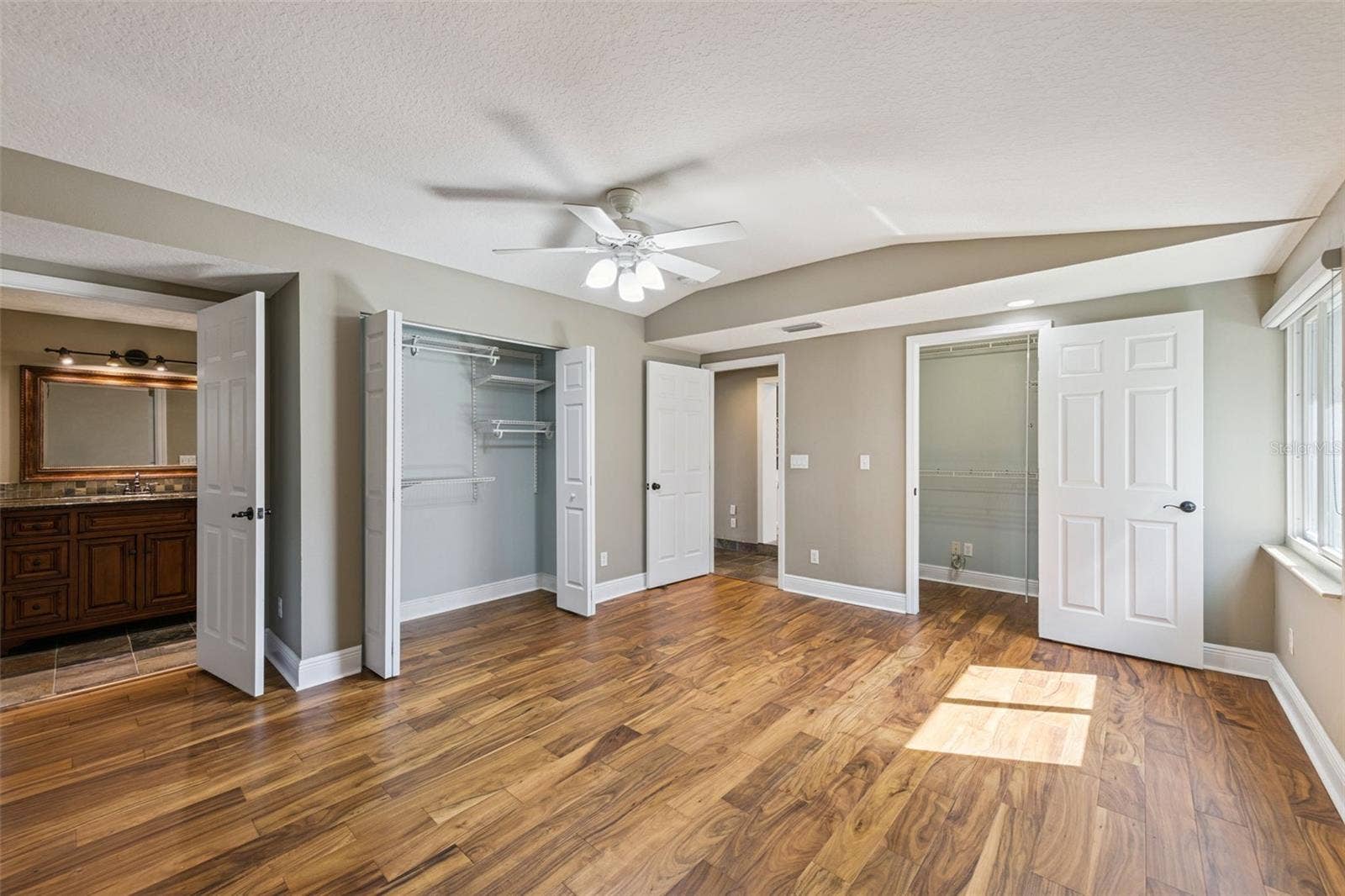 3115 HARGILL DRIVE, Orlando, FL 32806 Huge Primary Bedroom with 2 large closets and new wood luxury vinyl flooring