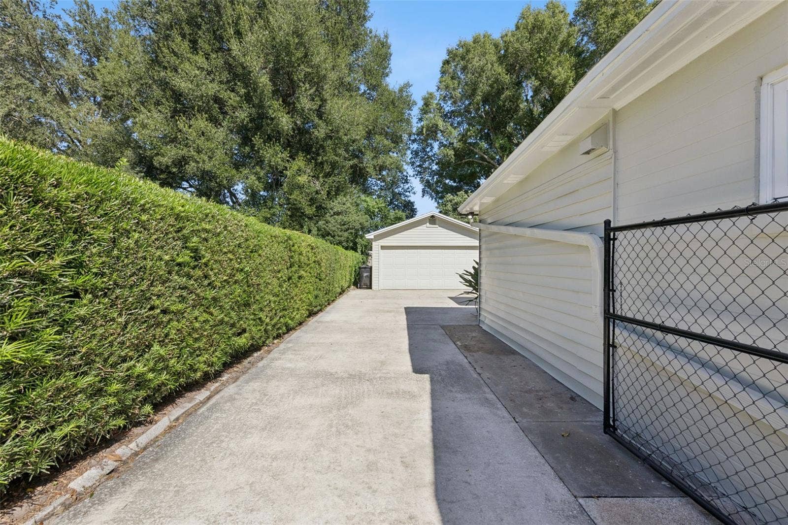 3115 HARGILL DRIVE, Orlando, FL 32806 Driveway back to the 4 car tandem garage.