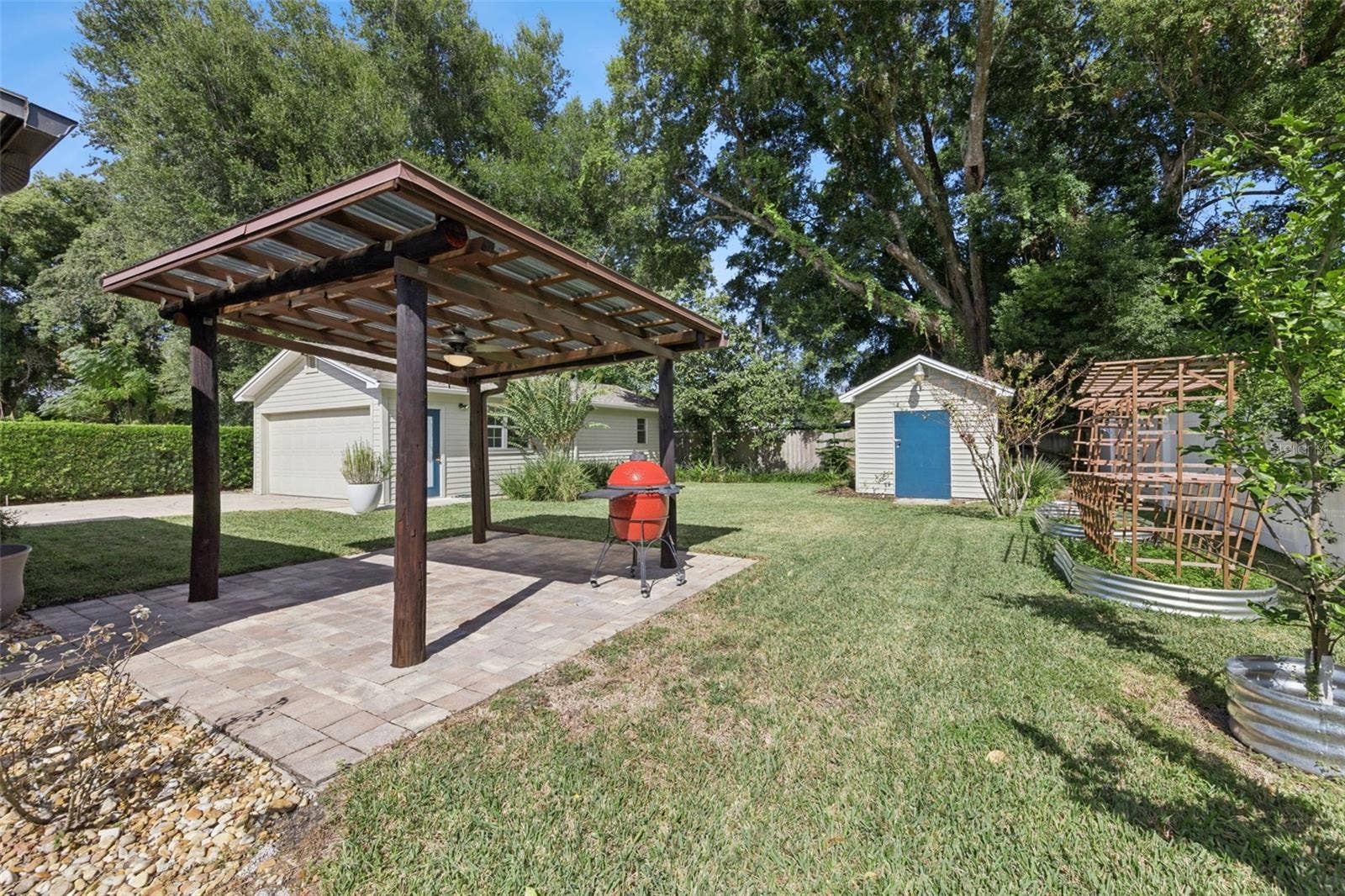 3115 HARGILL DRIVE, Orlando, FL 32806 Covered Grilling Gazebo, 12x12 Shed and Fruit trees and lots of pineapples are back here too.