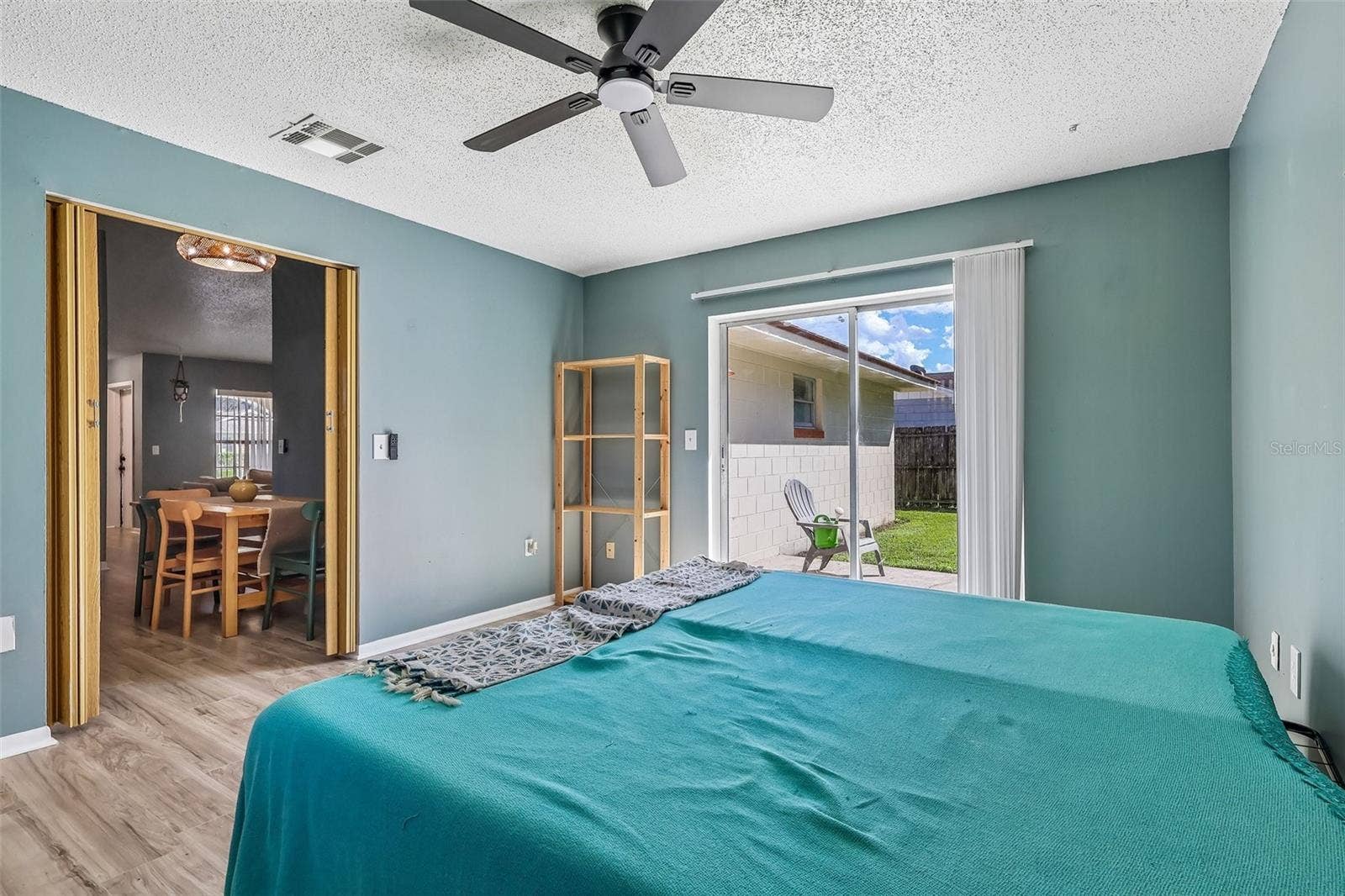 1332 BOREAS DRIVE, Orlando, FL 32822 There is a partition to close off this room for privacy as well as a sliding glass door to access the backyard