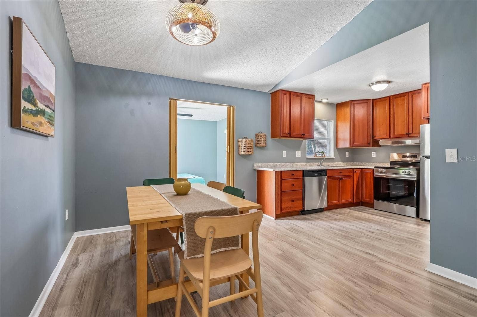 1332 BOREAS DRIVE, Orlando, FL 32822 The dining room opens up to the kitchen for enjoying meals with friends and family and easy hosting