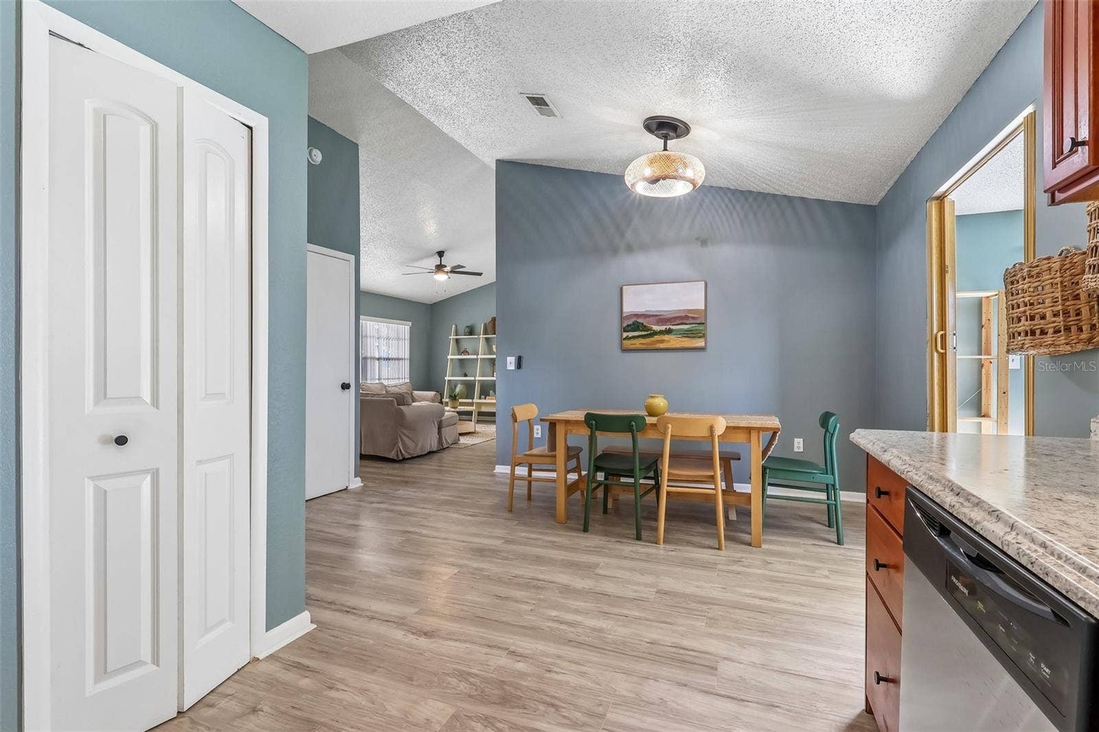 1332 BOREAS DRIVE, Orlando, FL 32822 View from the kitchen to the dining room and you have an updated modern light fixture