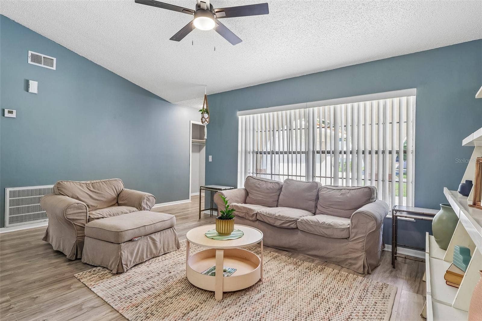 1332 BOREAS DRIVE, Orlando, FL 32822 The vaulted ceiling in the living room helps it feel spacious and airy