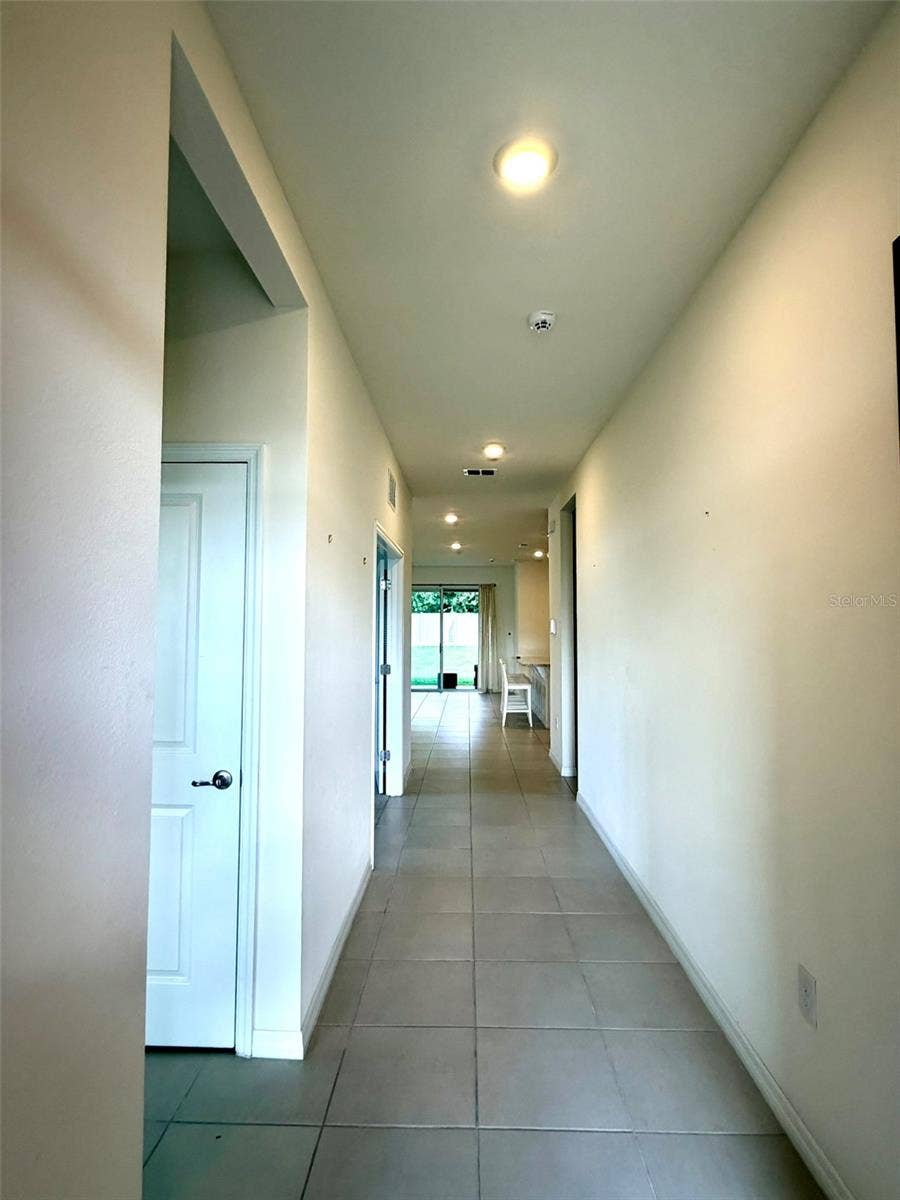 6345 SW 88TH LOOP, Ocala, FL 34476 Entrance hall. Bedroom 2, Full bath and closet to the left
