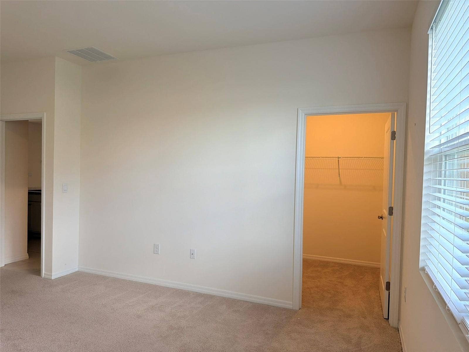 6345 SW 88TH LOOP, Ocala, FL 34476 Primary bedroom walk-in closet.