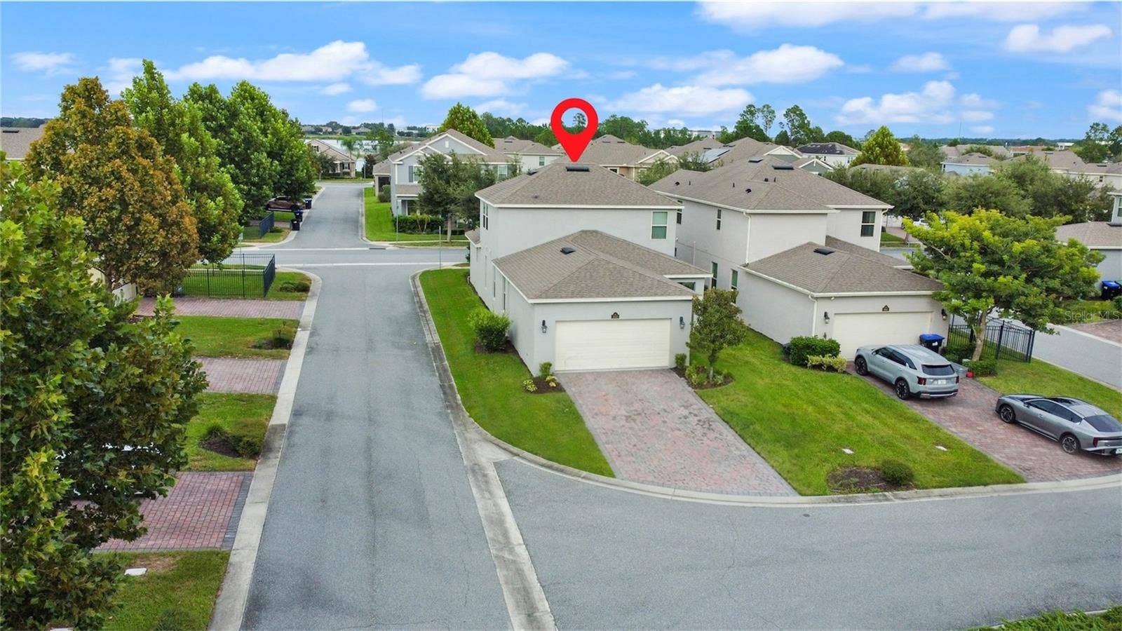9662 WATERWAY PASSAGE DRIVE, Winter Garden, FL 34787 Garage & driveway located in the rear of the home.
