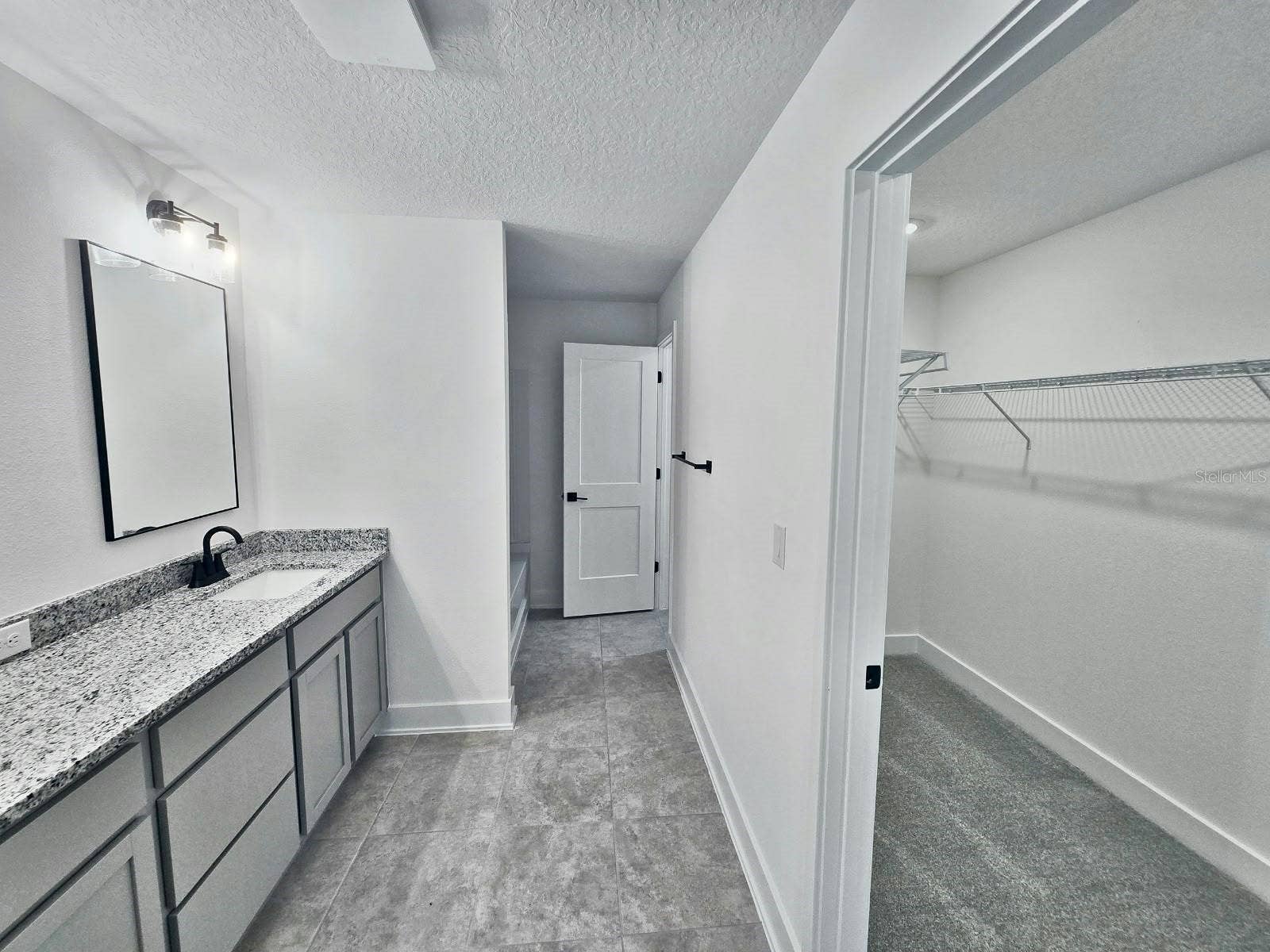 Primary bathroom and walk-in closet