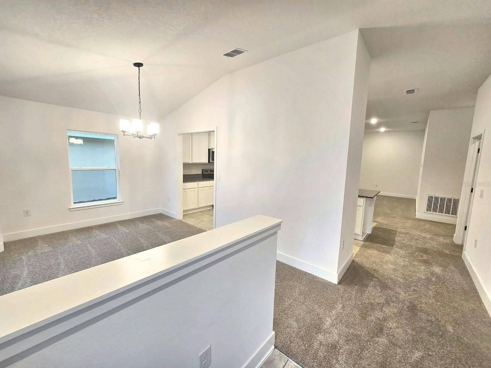 Foyer view to dining room and hall
