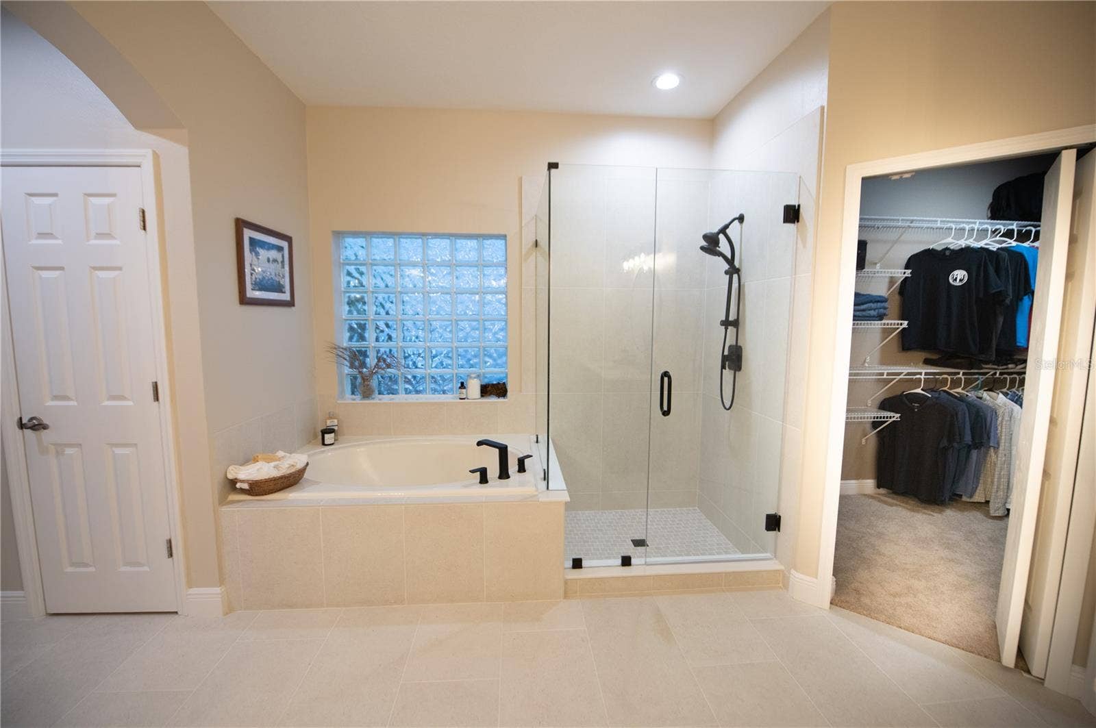 primary bathroom with new tile & shower & duel vanities